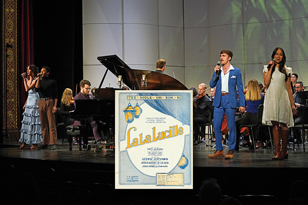 Singers and an orchestra performing Gershwin's "La, La, Lucille"