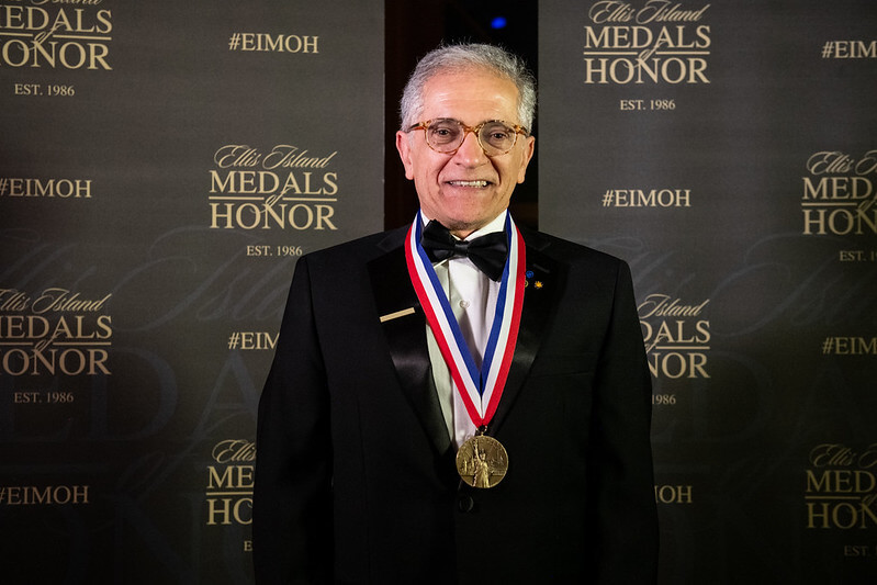 Kamal Sarabandi wearing the Ellis Island Medal of Honor